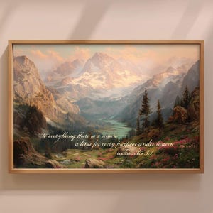 May include: A framed landscape painting of a mountain range with snow-covered peaks, a river, and verdant vegetation. The artwork uses a warm colour palette and includes the text: "to everything there is a season a time for every purpose under heaven ecclesiastes 3:1."