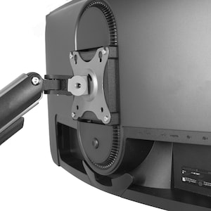 May include: A black monitor with a mounting bracket attached. The bracket is connected to a black arm with the text "31dee" printed on it. The monitor has several ports and a label on the back.