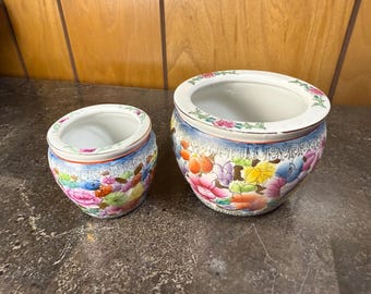 Pair of Chinese famille rose porcelain fishbowl planters with hand-painted floral motifs