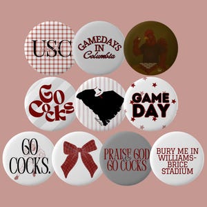 May include: A selection of circular badges with different designs and text. The badges display phrases such as "USC", "Gamedays in Columbia", "Go Cocks", "Game Day", "60 Cocks", "Praise God & 60 Cocks", and "Bury Me in Williams-Brice Stadium".