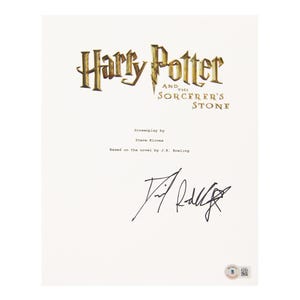 May include: A white page featuring the title "Harry Potter and the Sorcerer's Stone" in gold lettering. Below the title are the words "Screenplay by Steve Kloves" and "Based on the novel by J.K. Rowling." A signature is present.