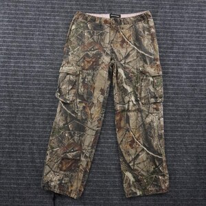 May include: Cargo pants featuring a camouflage pattern in shades of brown, tan, and green. The pants include a button and zipper closure, belt loops, and two large side cargo pockets with flaps on the thighs. The fabric has a realistic forest print.