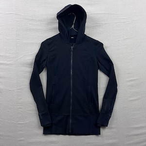 May include: Black hooded zip-up jacket with long sleeves. The jacket features a full-length zipper, a hood, and ribbed cuffs. The jacket is made of a smooth, athletic material. The jacket is designed for athletic wear.