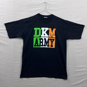 May include: A set of three ceramic mugs with a speckled, matte finish. The mugs are in shades of cream, light gray, and dark gray. Each mug has a simple, modern design and a rounded handle. Perfect for coffee or tea.