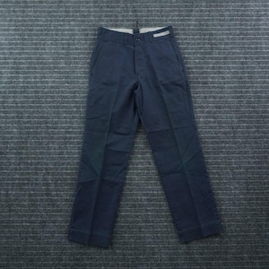 May include: A pair of dark navy blue trousers featuring a structured waistband with a single button closure, a front zipper fly, two side pockets, and a clean, straight-leg cut. The fabric has a smooth finish with visible vertical pressed creases.