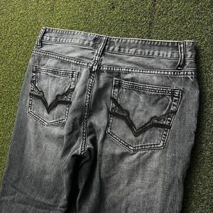 Jeans aderenti e dritti lavati Y2K INC