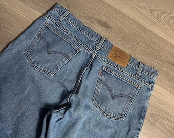 Vintage 1996 Levi's 550 Relaxed Fit Tapered Orange Tab Light Wash Denim Jeans