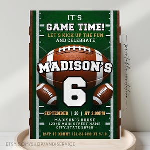May include: A rectangular invitation card featuring a green football field background with white yard lines. It displays three brown footballs, the text IT'S GAME TIME, MADISON'S, the number 6, and event details including date, time, and address.