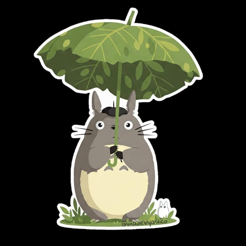 May include: A sticker featuring a gray, cartoon-style creature holding a green leaf umbrella. The creature has a cream-colored belly and is standing on grass with a small white creature nearby. The background is black.