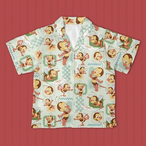 May include: Short-sleeved button-up shirt with a light green background and a repeating pattern of cartoon bees, flowers, and geometric shapes. The bees are brown and yellow with smiling faces. The shirt has a classic collar and short sleeves.