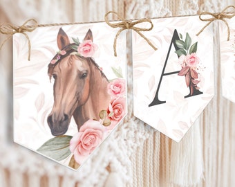 May include: A banner with a horse head, a floral letter A, and a floral letter B. The horse has a pink flower crown and is surrounded by pink roses and green leaves. The letters are also surrounded by pink roses and green leaves.