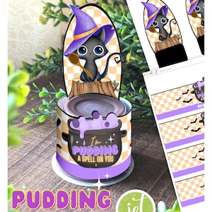 May include: Printable Halloween pudding labels featuring a black cat wearing a purple witch hat and holding a wooden spoon. The labels say "I'm Pudding a Spell on You".