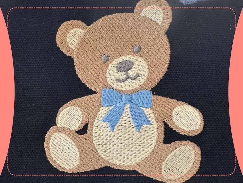 May include: Embroidered teddy bear patch with a light brown body, tan accents, and a blue bow tie. The bear has a stitched design with a smiling face and is set against a dark blue background.