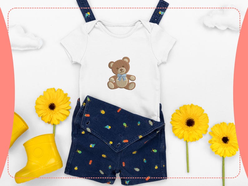 May include: A white baby onesie with a brown teddy bear design and a blue bow, paired with dark blue denim shorts featuring colorful patterns. Yellow rubber boots and sunflowers complete the playful ensemble.