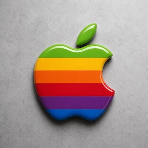 May include: A glossy, rainbow-striped apple logo with a green leaf. The apple is composed of horizontal stripes in the colors of the rainbow: red, orange, yellow, green, blue, and purple. The logo is set against a gray background.