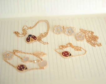 Lucky flower plum blossom MOP bracelet, earrings, necklace with ladybug. Rose gold plated. White mother of pearl spring flower pendant