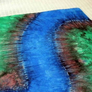 May include: Abstract art painting with a blue, green, and brown color scheme. The colors are blended together to create a flowing, organic design.