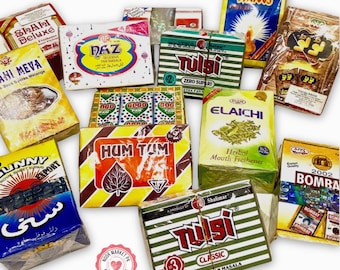 May include: Assortment of colorful packages of pan masala products, including brands like Tulsi, Hum Tum, and Elaichi. The packages feature various designs and text, with a focus on herbal mouth fresheners and sweet supari.