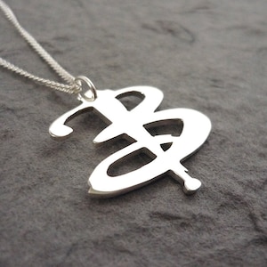 Sterling silver Handmade B-uffy pendant