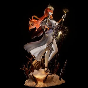 May include: A detailed anime-style figurine of a character with long orange hair, wearing a flowing white dress with gold accents and a headpiece. The figure holds a dark staff, stands on a rocky base, and is surrounded by several dark sword-like objects.