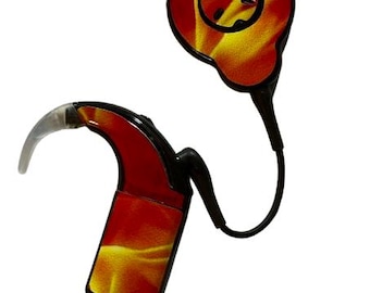 May include: A cochlear implant processor featuring a vibrant red and yellow flame pattern on its exterior casing. The device includes a black main body, a curved clear ear hook, and a circular external coil connected by a black cable.
