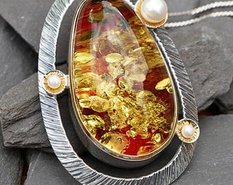 Red Amber Statement Pendant In Carved Sterling Silver – with Golden Inclusions & Mother Of Pearl