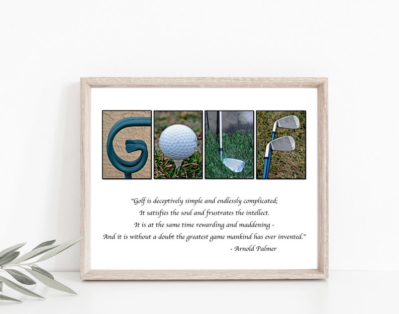 May include: A framed print with the word "GOLF" spelled out using images. The "G" is a teal-colored metal structure, the "O" is a golf ball on a tee, the "L" is a golf club in grass, and the "F" is two golf clubs. Text below reads "Golf is deceptively simple..." by Arnold Palmer.