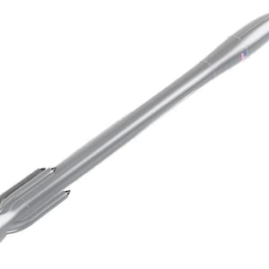 May include: A silver rocket-shaped pen with a streamlined design. The pen has a pointed tip and fins at the base, with a small detail near the top. The pen is set against a white background.