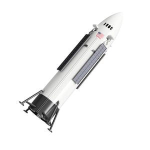 May include: A white and black model rocket with solar panels and the American flag. The rocket has a pointed nose cone and is angled slightly. The rocket has black legs and is set against a white background.