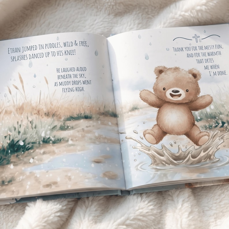 May include: An open children's book with illustrations and text. The left page has text about jumping in puddles. The right page shows a brown teddy bear jumping in a puddle. The text on the right page says "Thank you for the messy fun..."