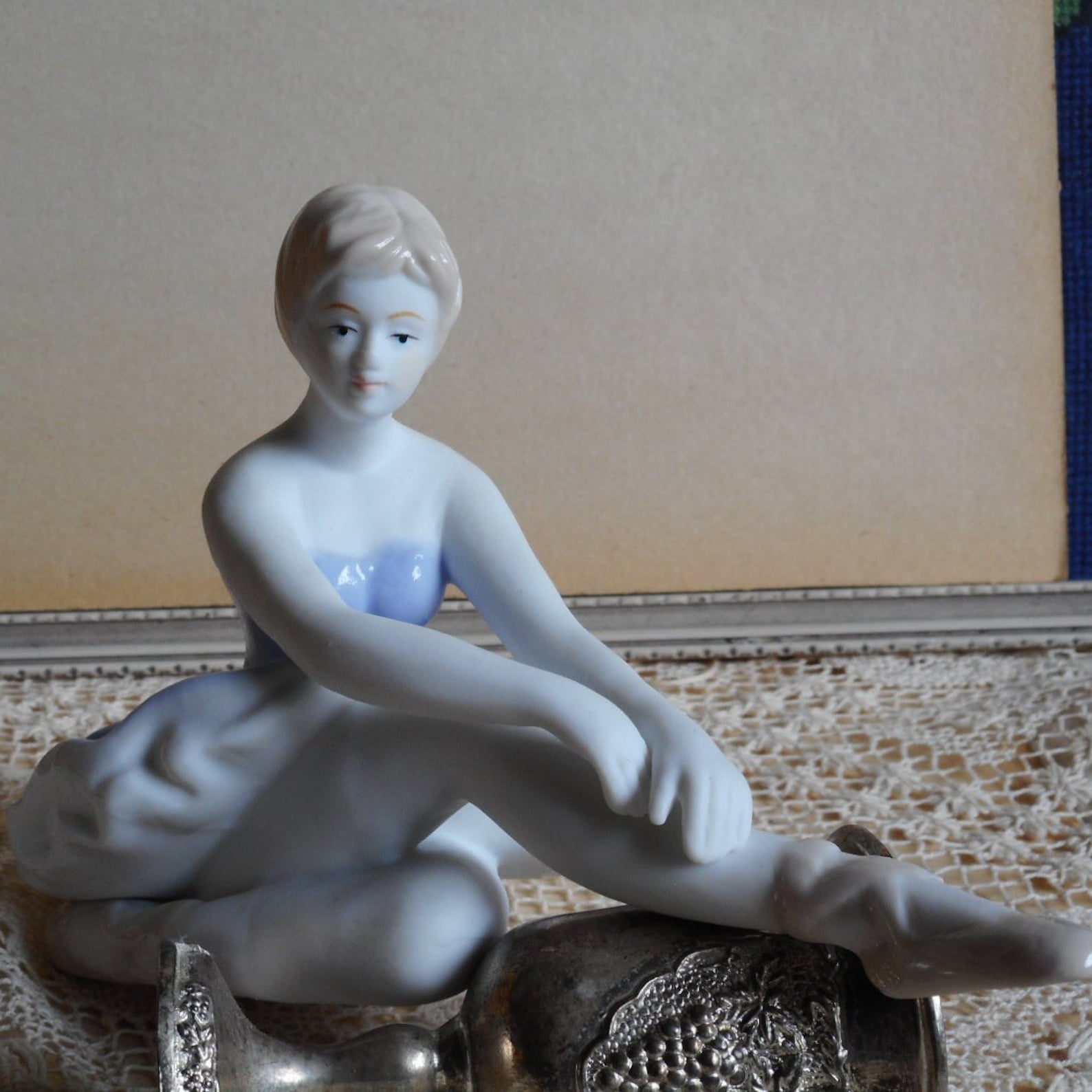 vintage fine porcelain ballerina. very soft blue and white dress. light beige hair and shoes. ballet dancer.