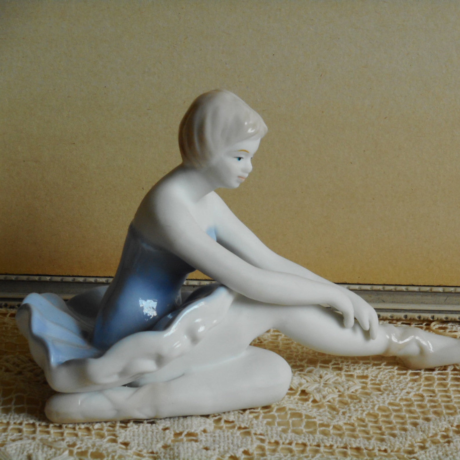 vintage fine porcelain ballerina. very soft blue and white dress. light beige hair and shoes. ballet dancer.
