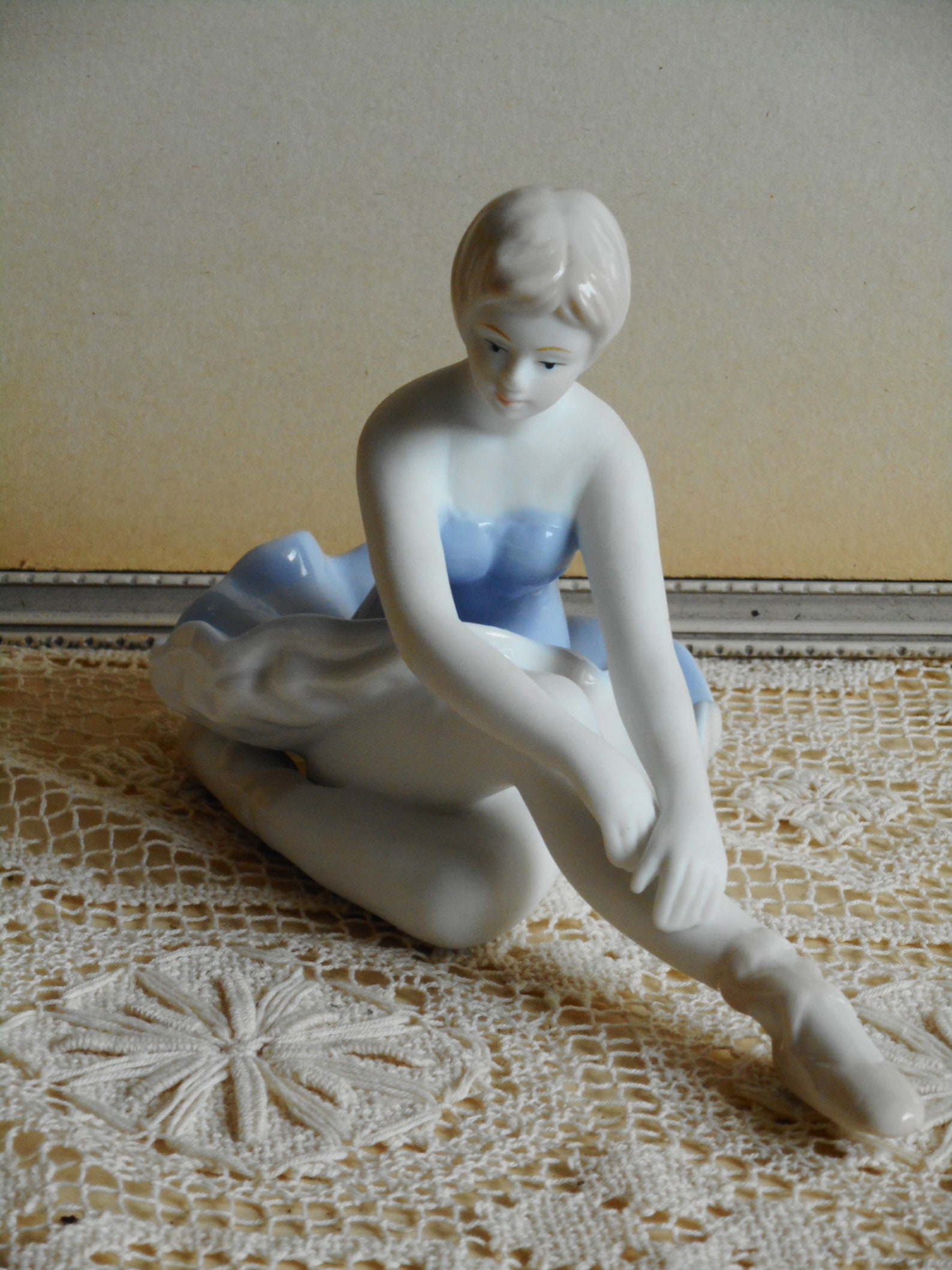 vintage fine porcelain ballerina. very soft blue and white dress. light beige hair and shoes. ballet dancer.