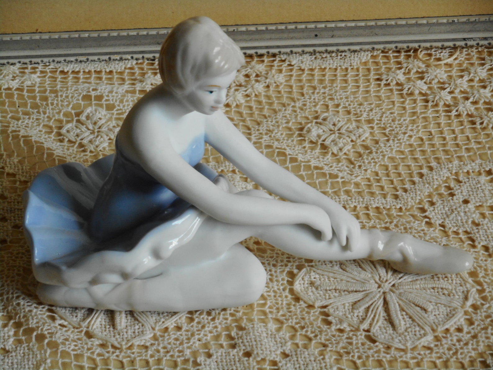 vintage fine porcelain ballerina. very soft blue and white dress. light beige hair and shoes. ballet dancer.