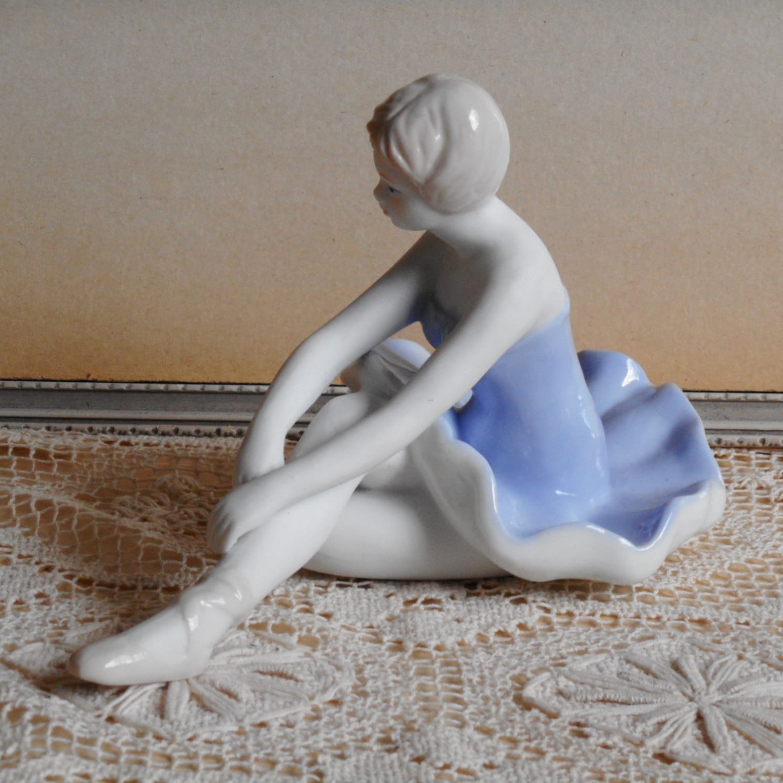 vintage fine porcelain ballerina. very soft blue and white dress. light beige hair and shoes. ballet dancer.