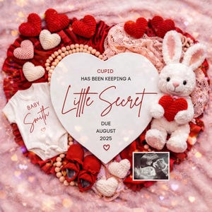 May include: A heart-shaped pregnancy announcement with a white onesie, red baby shoes, and a plush bunny holding a red heart. The announcement reads "Cupid Has Been Keeping a Little Secret Due August 2025."
