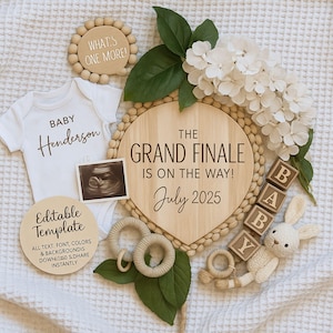 May include: A baby announcement with a white babygrow printed with "Baby Henderson", a sonogram, wooden blocks spelling "BABY", and a sign saying "The Grand Finale is on the way! July 2025". Includes a wooden sign, flowers, and a stuffed bunny.