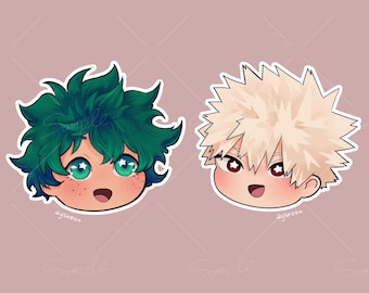 May include: Two cartoon character stickers. One has green spiky hair, green eyes, and freckles. The other has spiky blonde hair and red eyes. Both have smiling faces and are on a pink background.