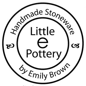 May include: Black and white circular stamp with the text "Handmade Stoneware Little e Pottery by Emily Brown" and a stylized infinity symbol on each side.