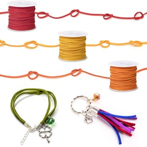 May include: An assortment of craft supplies including spools of red, yellow, and orange suede cord, a green suede bracelet with a four-leaf clover charm, and a keychain with a paw print charm and colorful tassel.