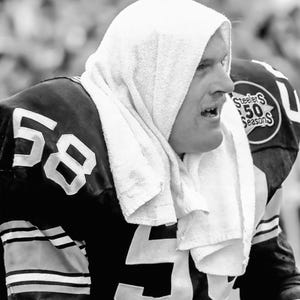 Pittsburgh steeler #58 jack lambert takes a break at Pittsburghs three rivers stadium. Wall Art, Home Decor, Great gift for Steelers Dad