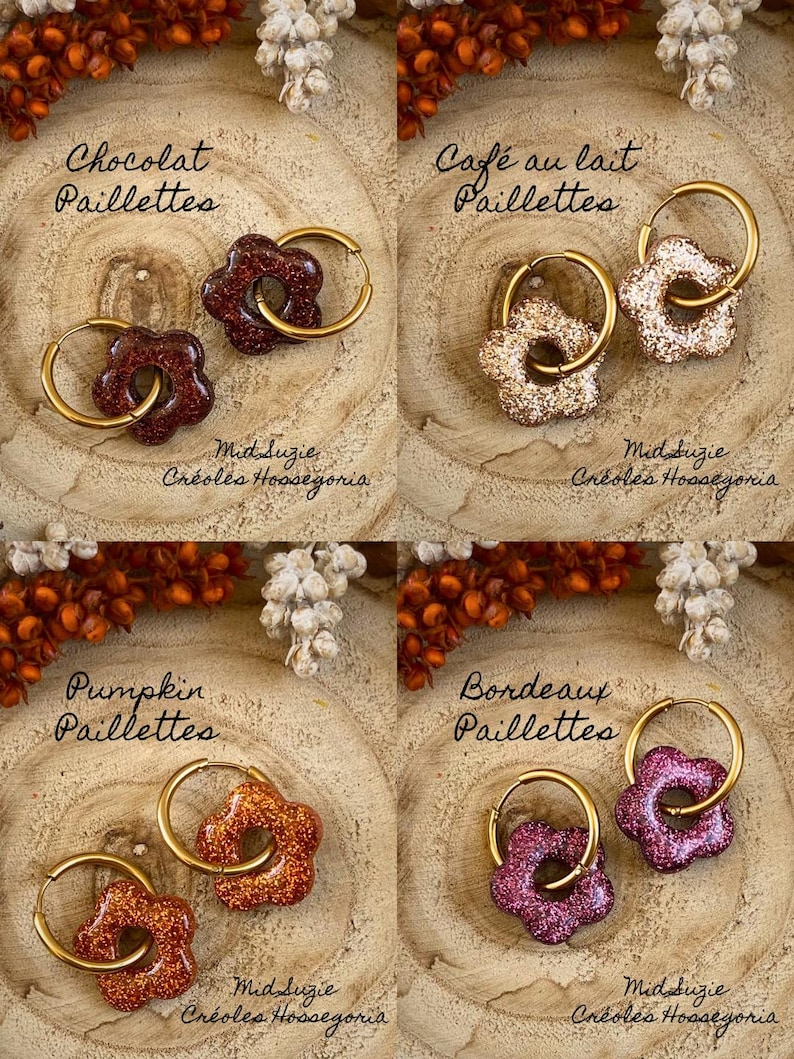 May include: Four pairs of flower-shaped earrings with gold hoops. The earrings are in shades of brown, beige, orange, and purple, with glitter accents. The text on the image reads "Chocolat Paillettes", "Caf&eacute; au lait Paillettes", "Pumpkin Paillettes", and "Bordeaux Paillettes".