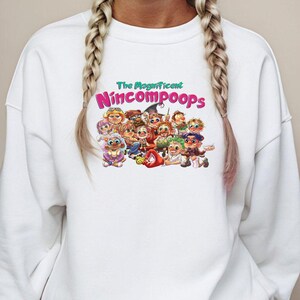 The Magnificent Nincompoops Unisex Sweatshirt | Funny Cozy Pullover for Men & Women | Quirky Graphic Gift | Soft Casual Statement Top
