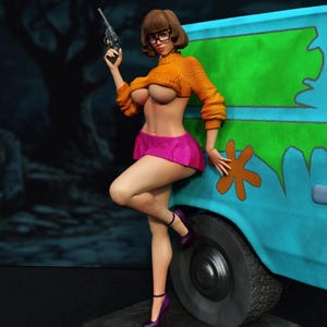 May include: A figurine of a woman in an orange sweater, pink skirt, and purple heels, holding a gun. She is leaning against a blue van with green and orange accents. The background is a dark, blurred forest.