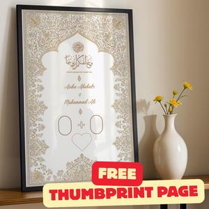 May include: A framed vertical wall art print featuring intricate gold filigree borders and Arabic calligraphy. The text reads Aisha Abubakar & Muhammad Ali with the English translation And We Created You In Pairs. It includes two empty ovals, a plus sign, and a heart outline.
