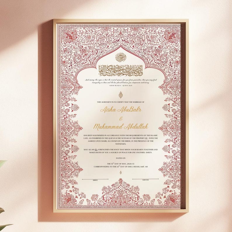 May include: A rectangular Islamic marriage certificate in a gold frame featuring intricate red floral patterns along the border. The text includes the names Aisha AbuBakr and Muhammad Abdullah, with Arabic calligraphy at the top and English text below.