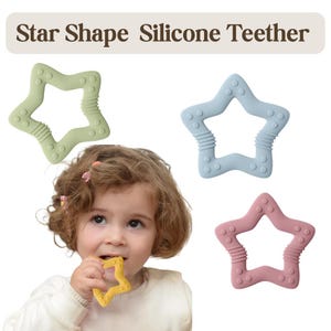 May include: The image shows a baby with a yellow star-shaped silicone teether in their mouth. Three other star-shaped teethers are displayed in green, blue, and pink. The text "Star Shape Silicone Teether" is at the top.