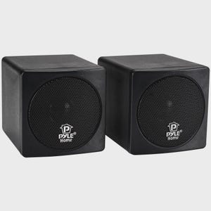 May include: Two black, square Pyle Home speakers. Each speaker has a mesh grill covering the circular speaker. The Pyle Home logo is centered on the speaker. The speakers are on a light gray background.