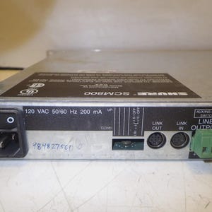 May include: A silver Shure SCM800 audio mixer with a black power switch and various input/output ports. The device has text that reads "120 VAC 50/60 Hz 200 mA". The serial number 984827561 is visible.