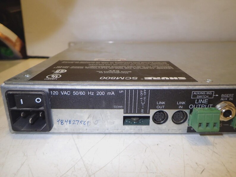 May include: A silver Shure SCM800 audio mixer with a black power switch and various input/output ports. The device has text that reads "120 VAC 50/60 Hz 200 mA". The serial number 984827561 is visible.